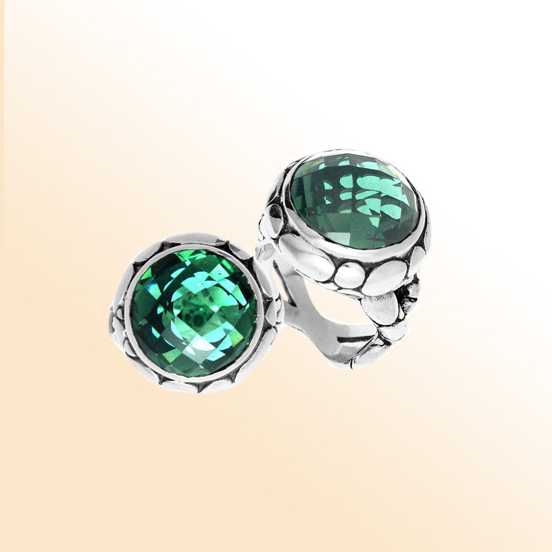 Handmade sterling silver Balinese ring with round faceted Green Quartz in a bold bezel.