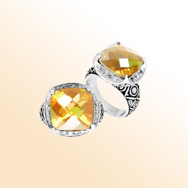Handmade sterling silver Balinese ring with cushion-cut Lemon Quartz in a detailed setting.