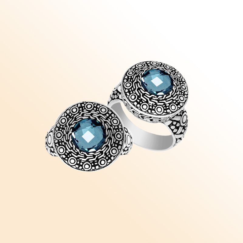 Handmade sterling silver Balinese ring with round-cut Blue Topaz Quartz and ornate engraved bezel.