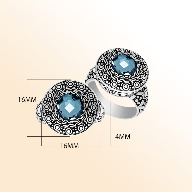 Handmade sterling silver Balinese ring with round-cut Blue Topaz Quartz and ornate engraved bezel.