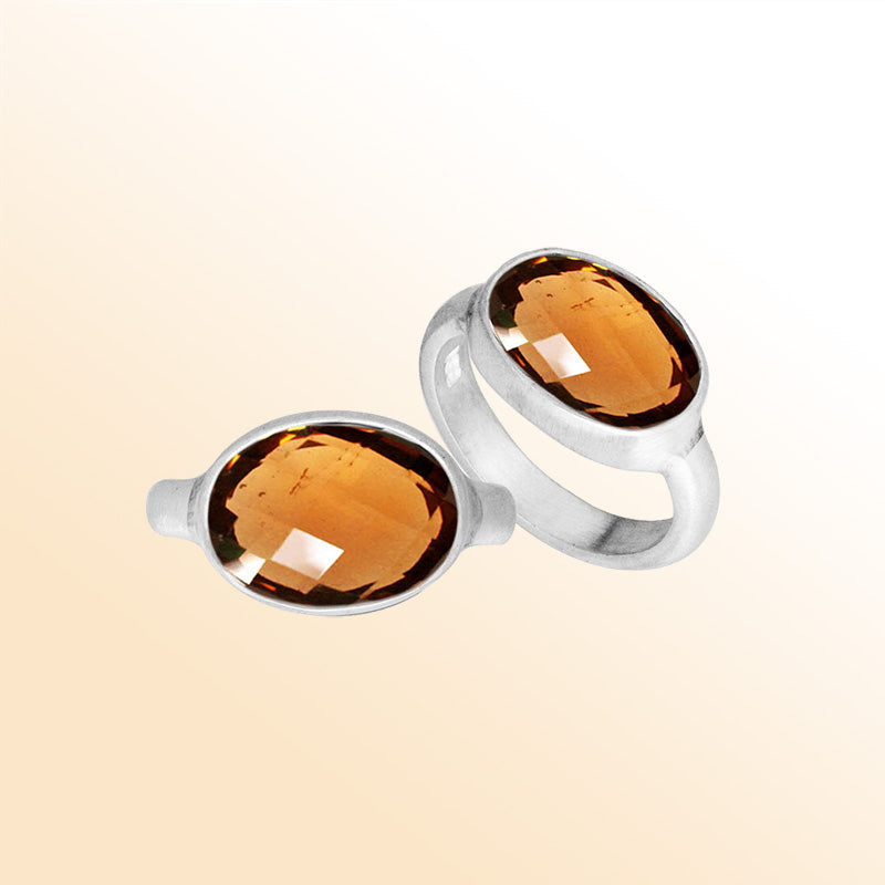 Handmade Sterling Silver ring with twin oval Citrine Quartz stones, polished Bali artisan design.