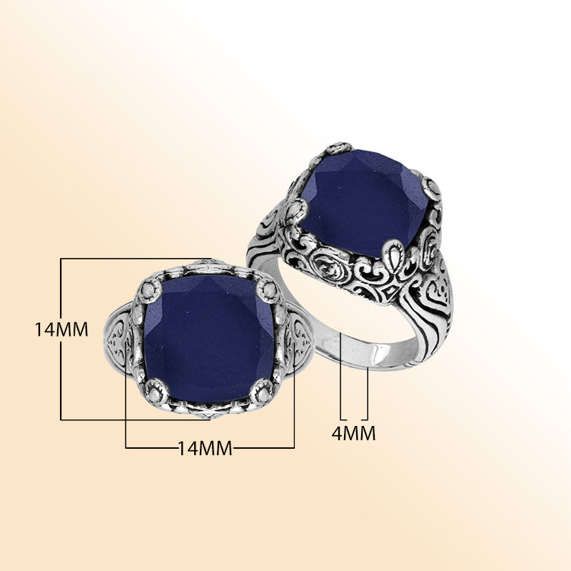 Sterling Silver vintage-inspired ring featuring Blue Sapphire and an ornate handcrafted Balinese design.