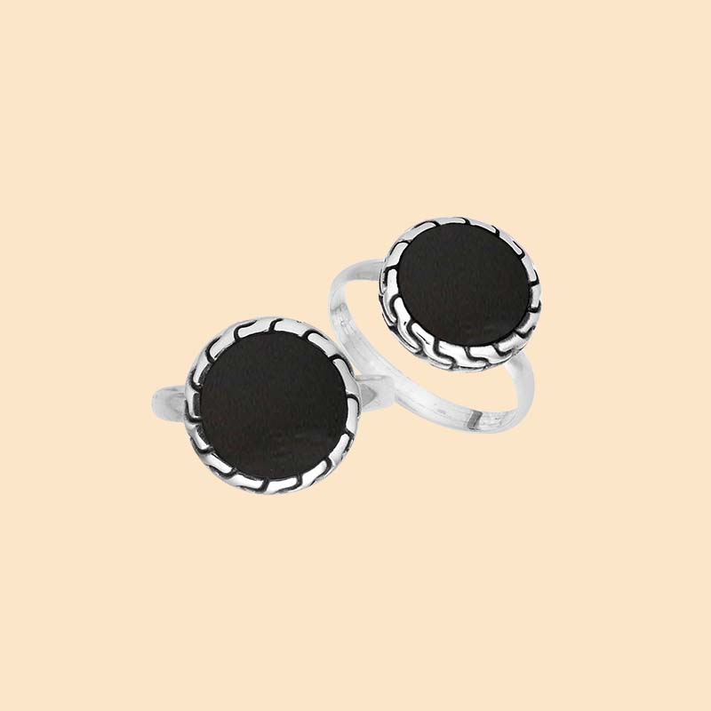 Bold sterling silver ring showcasing a round Black Shell centerpiece surrounded by sculpted oxidized silver detailing and a sleek polished band.