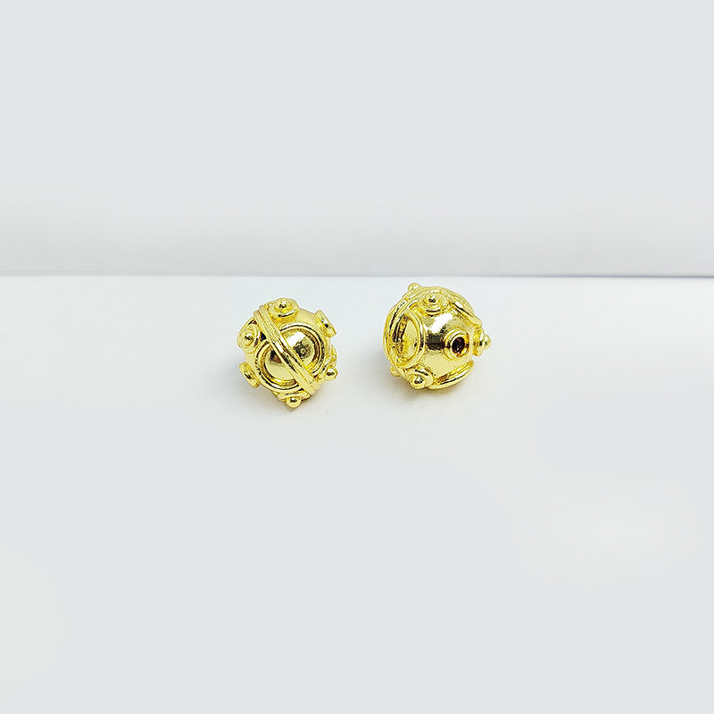 18K gold overlay Bali bead with ornate handcrafted detailing and radiant artisan finish for jewelry designs.