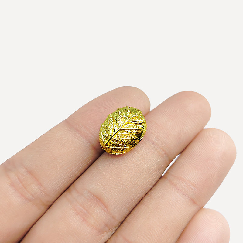 Handcrafted Indian leaf-design bead with 18K gold overlay on copper for retail jewelry making.