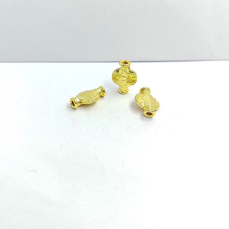 India-crafted textured mini vessel bead with 18K gold overlay and copper core for retail jewelry making.
