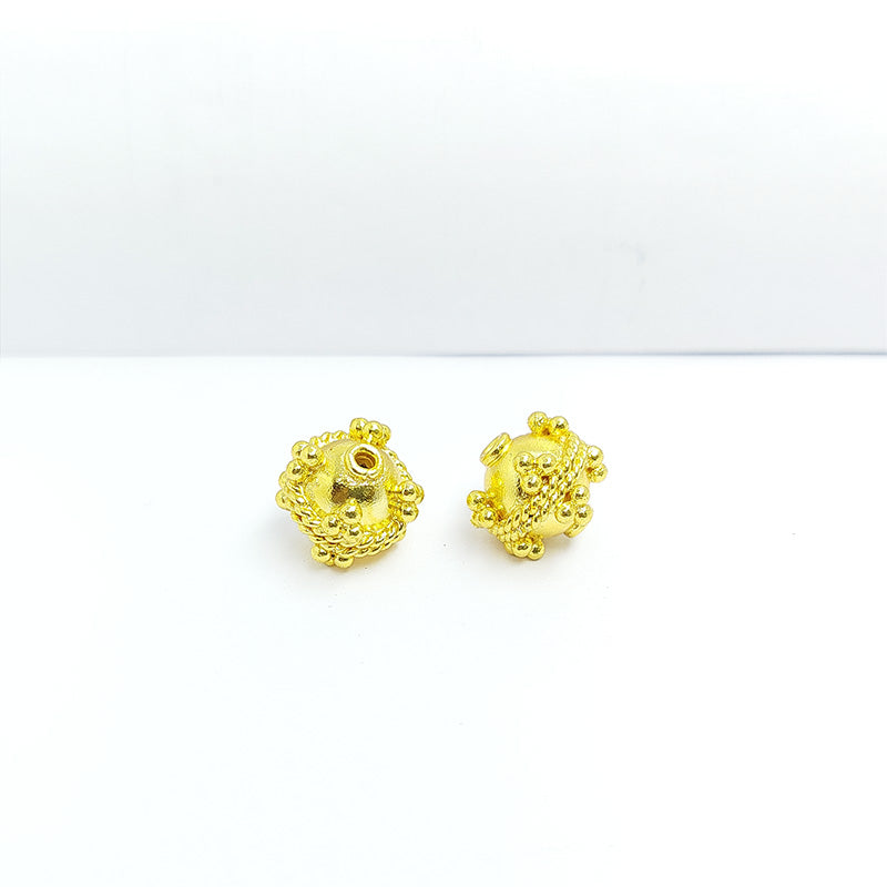 Handcrafted 18K gold overlay copper bead with granulated dots and rope-border design from India for jewelry making.