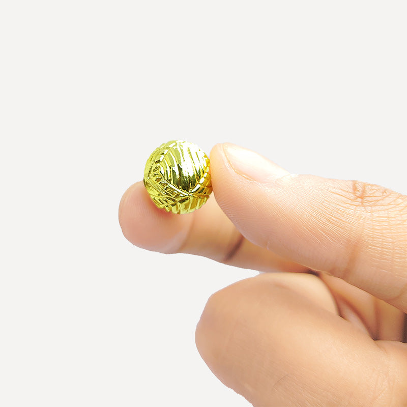 Handcrafted 18K gold overlay copper bead with engraved floral star design from India for jewelry making.