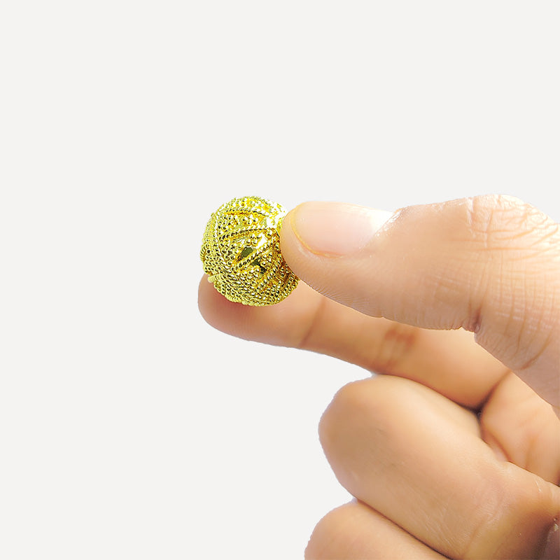 Handcrafted 18K gold overlay copper bead with rope-textured and granulated design from India for jewelry making.