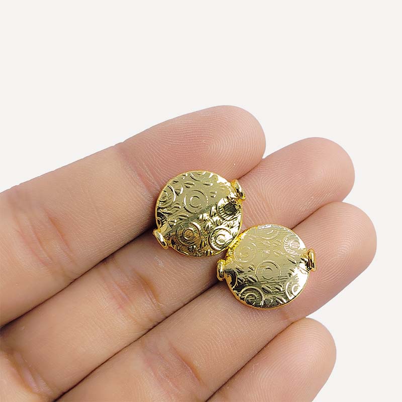 Handcrafted 18K gold overlay copper disc bead with embossed circular pattern from India for jewelry making.