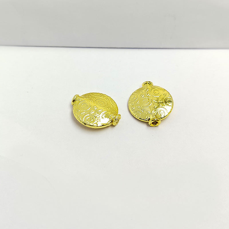 Handcrafted 18K gold overlay copper disc bead with embossed circular pattern from India for jewelry making.