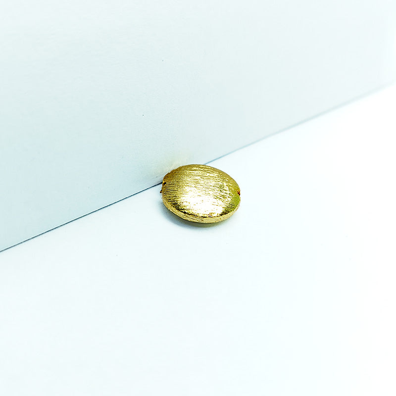 Handcrafted 18K gold overlay brushed coin-shaped copper bead with notch design from India.