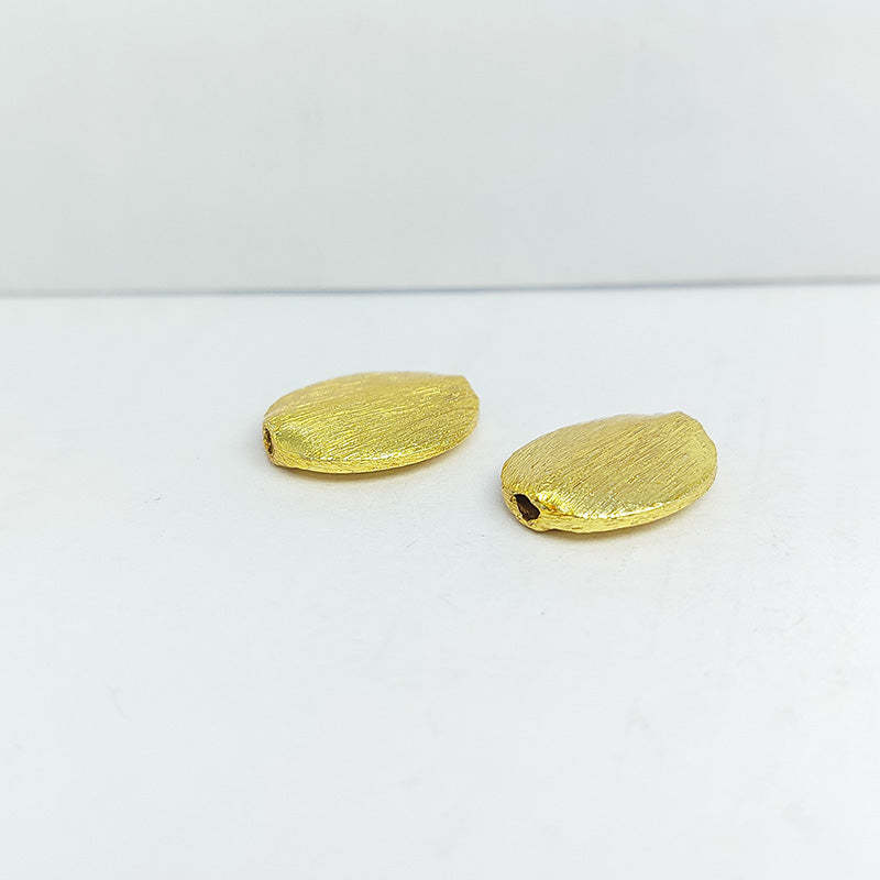 Handcrafted brushed flat oval bead made from copper with 18K gold overlay, crafted in India.