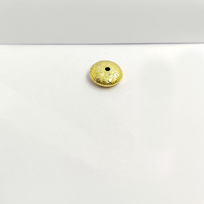 Elegant handcrafted round bead with engraved spiral design made from 18K Gold Overlay Over Copper in India.