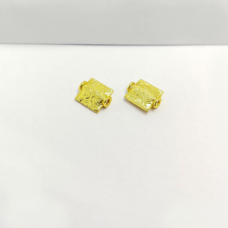 Elegant handcrafted rectangular bead made from 18K Gold Overlay Over Copper in India with engraved circular and geometric detailing.