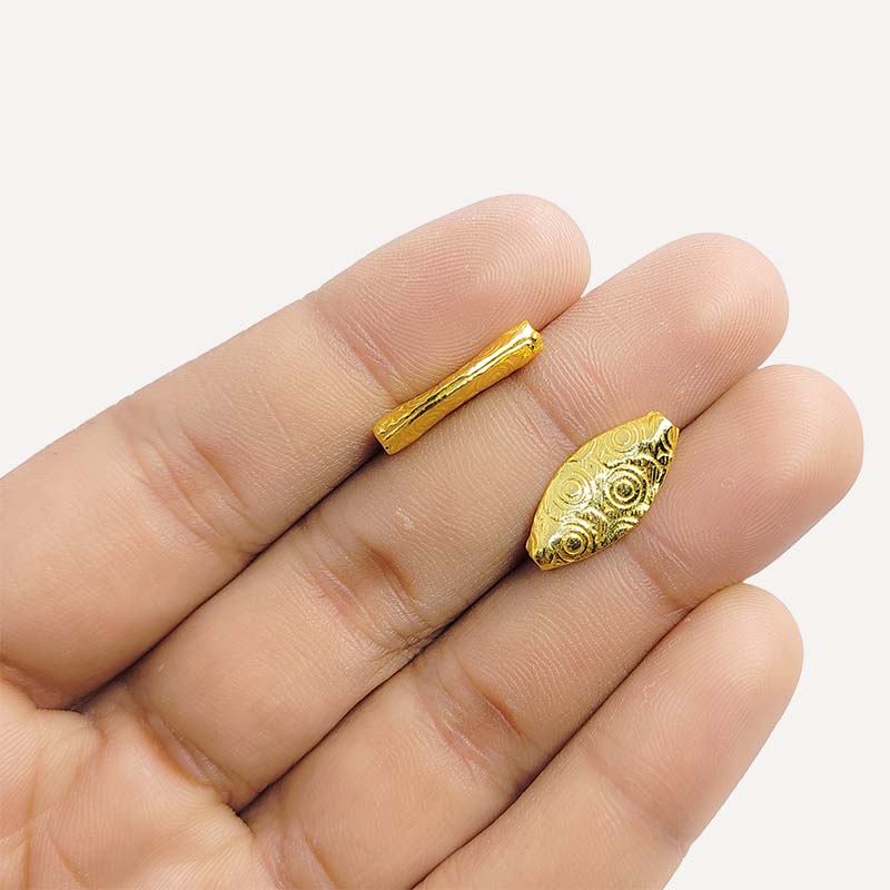 Elegant handcrafted oval bead made from 18K Gold Overlay Over Copper in India with engraved circular detailing.