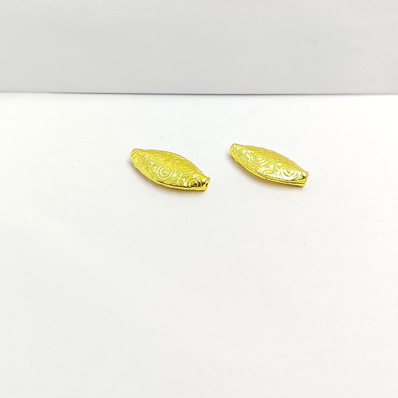 Elegant handcrafted oval bead made from 18K Gold Overlay Over Copper in India with engraved circular detailing.