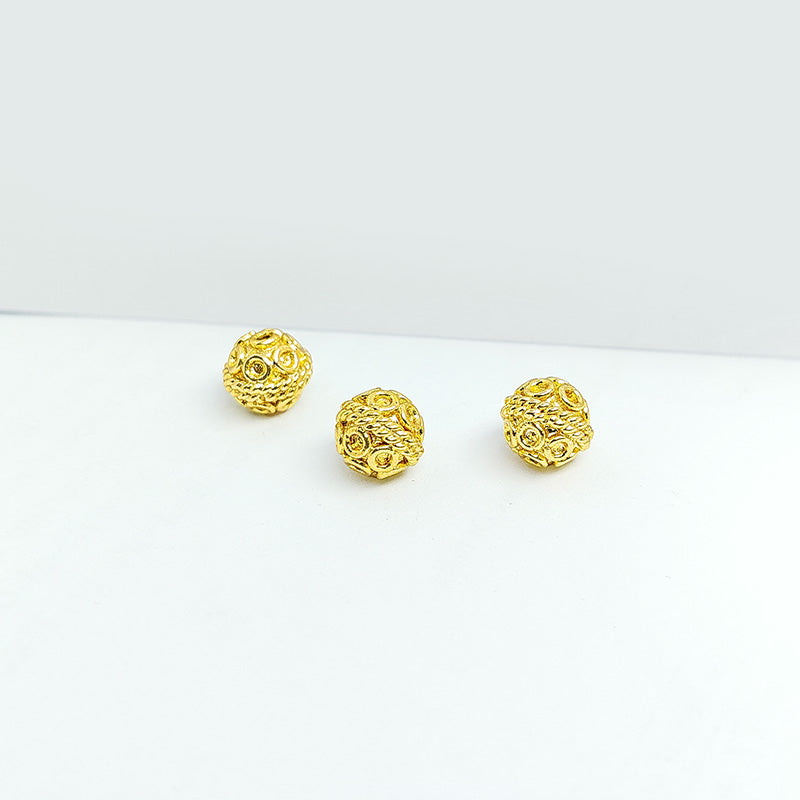 Elegant handcrafted openwork round bead made from 18K Gold Overlay Over Copper in India with decorative circular detailing.