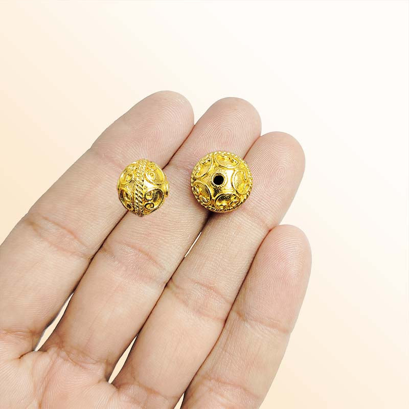 Elegant handcrafted openwork round bead made from 18K Gold Overlay Over Copper in India with raised circular detailing.