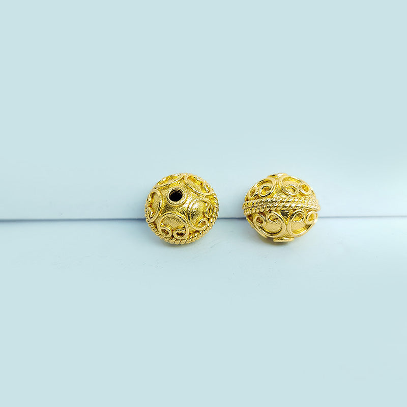 Elegant handcrafted openwork round bead made from 18K Gold Overlay Over Copper in India with raised circular detailing.