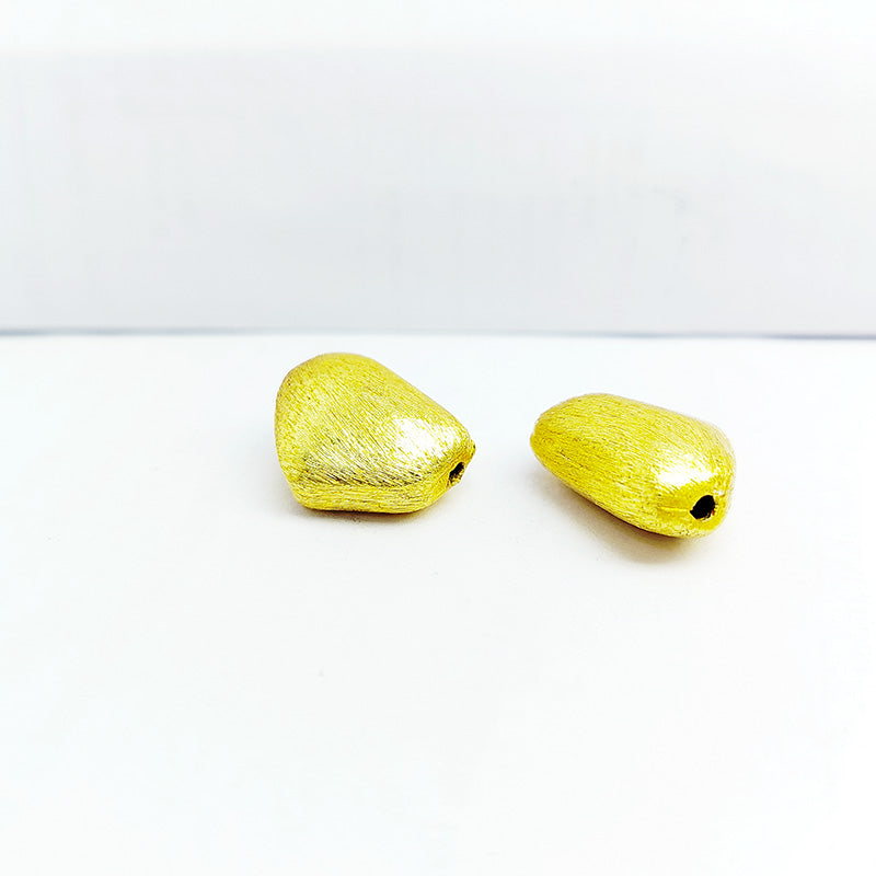 Organic pebble jewelry accent with 18K gold overlay over copper handcrafted in India