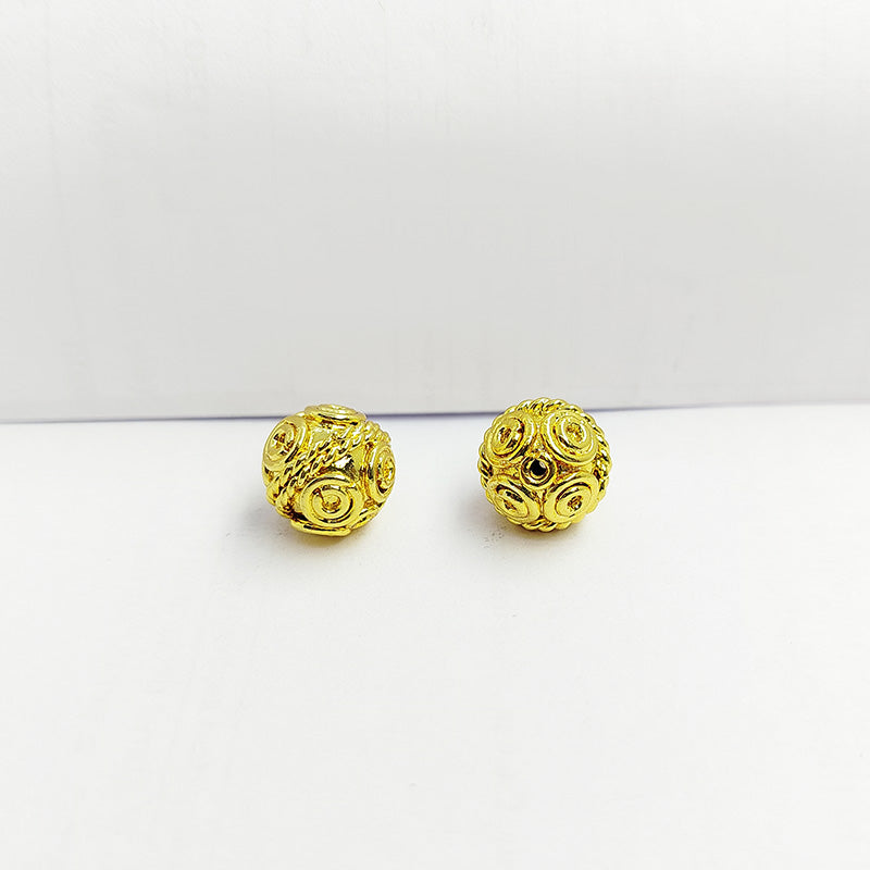 Spiral round jewelry bead with 18K gold overlay over copper handcrafted in India