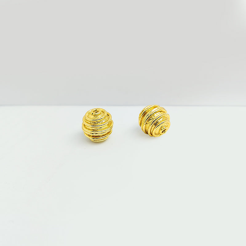 Ridged round jewelry bead with 18K gold overlay over copper handcrafted in India