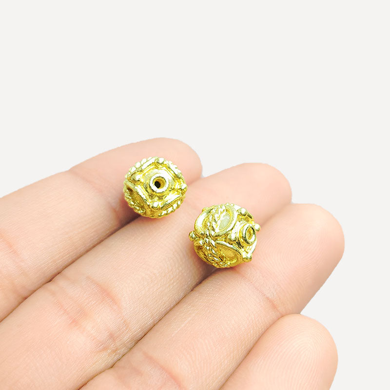 Ornate cube jewelry bead with 18K gold overlay over copper handcrafted in India