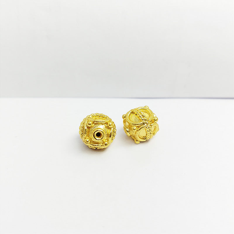 Ornate cube jewelry bead with 18K gold overlay over copper handcrafted in India