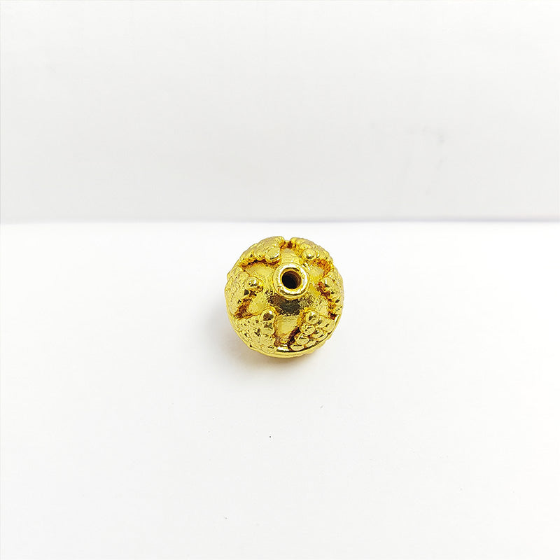 Floral textured round jewelry bead with 18K gold overlay over copper handcrafted in India