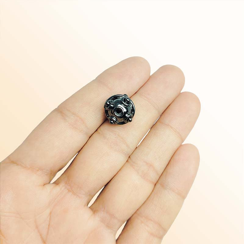 Handcrafted black rhodium overlay copper spacer bead from India with decorative raised details