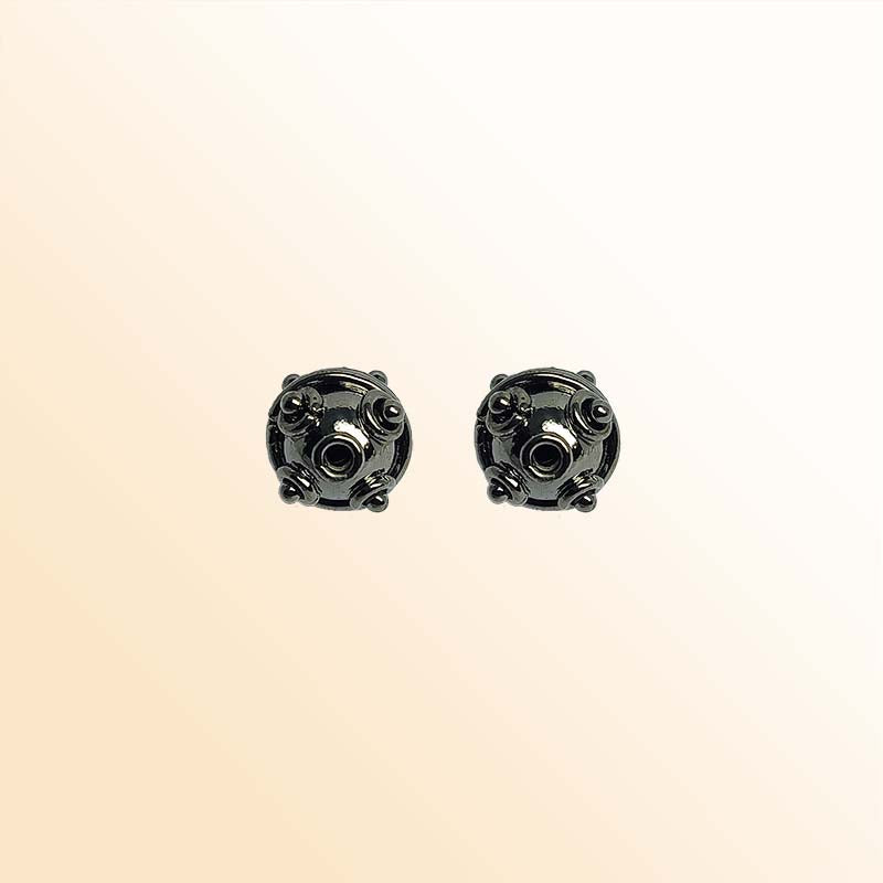 Handcrafted black rhodium overlay copper spacer bead from India with decorative raised details