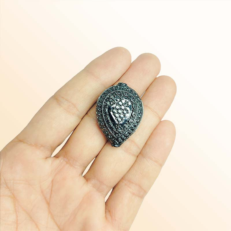 Handcrafted black rhodium overlay over copper bead with bold textured design made in India