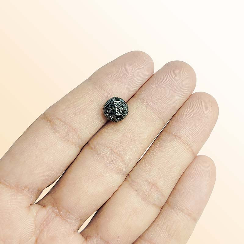 Handcrafted black rhodium overlay copper ornate round bead from India with vintage circular texture
