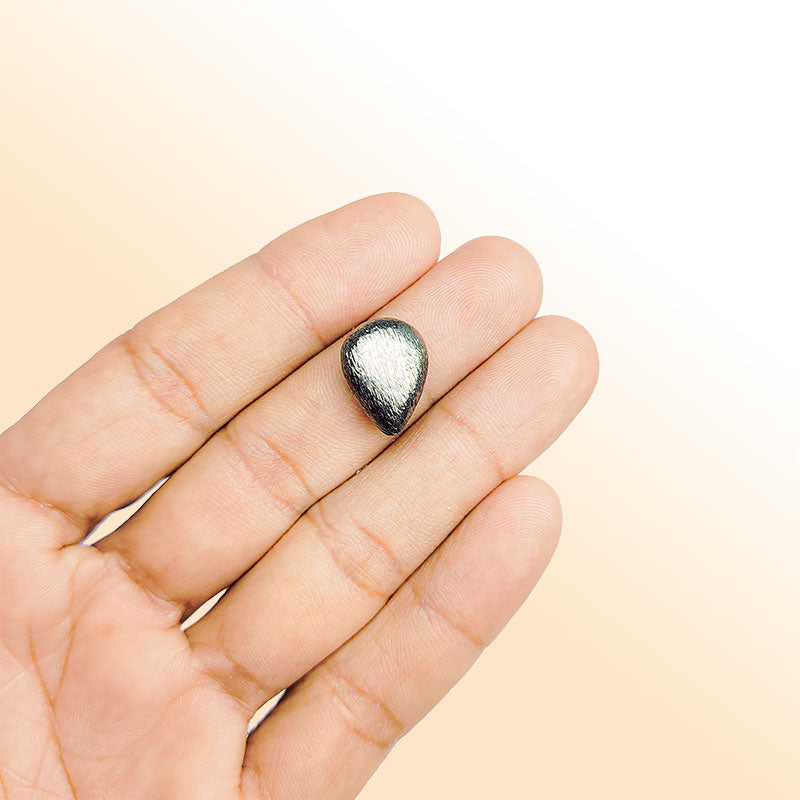 Handcrafted black rhodium overlay copper textured teardrop bead from India with brushed minimalist finish