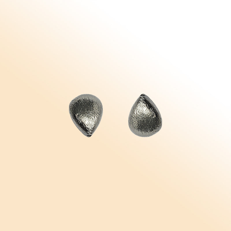 Handcrafted black rhodium overlay copper textured teardrop bead from India with brushed minimalist finish