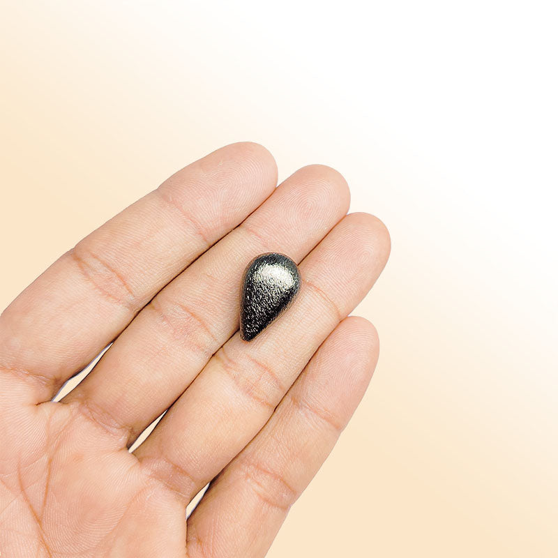 Handcrafted black rhodium overlay copper textured teardrop bead from India with brushed minimalist finish