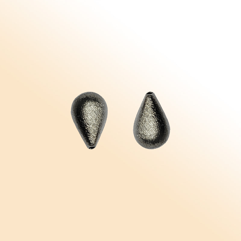 Handcrafted black rhodium overlay copper textured teardrop bead from India with brushed minimalist finish