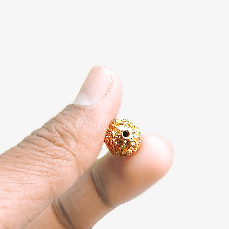 Ornate rose gold overlay copper scroll bead handcrafted in India for jewelry designs