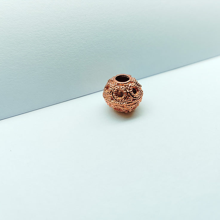 Textured rose gold overlay copper granulated medallion bead handcrafted in India for jewelry designs