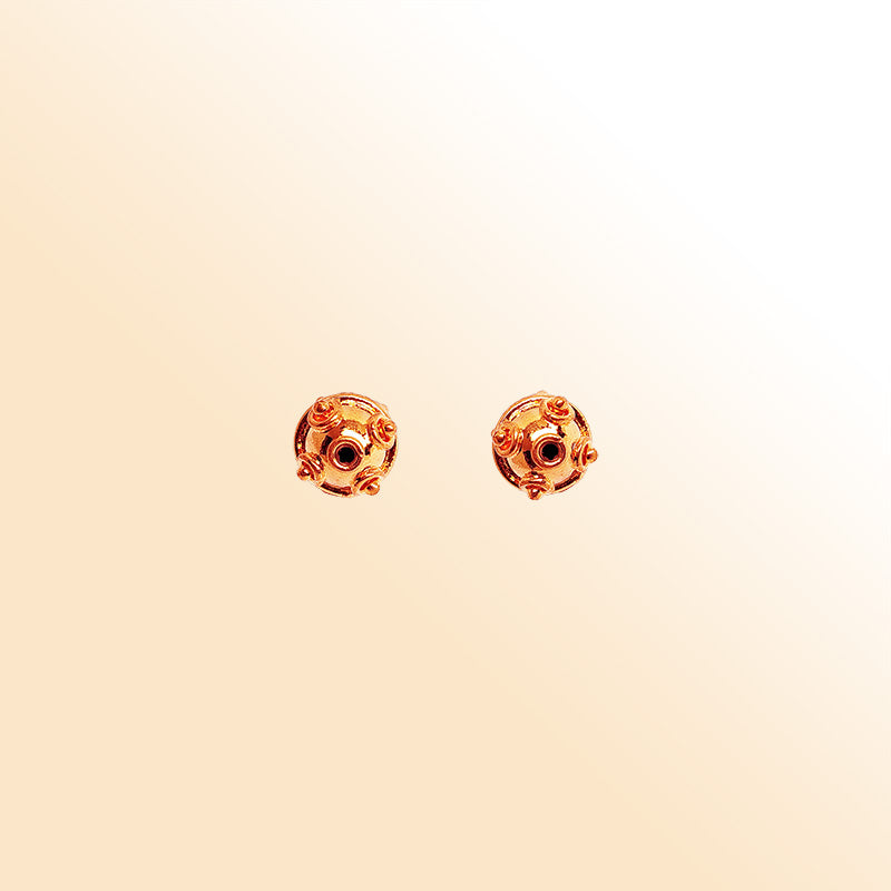 Handcrafted round Rose Gold bead from India featuring decorative swirl detailing for elegant jewelry designs
