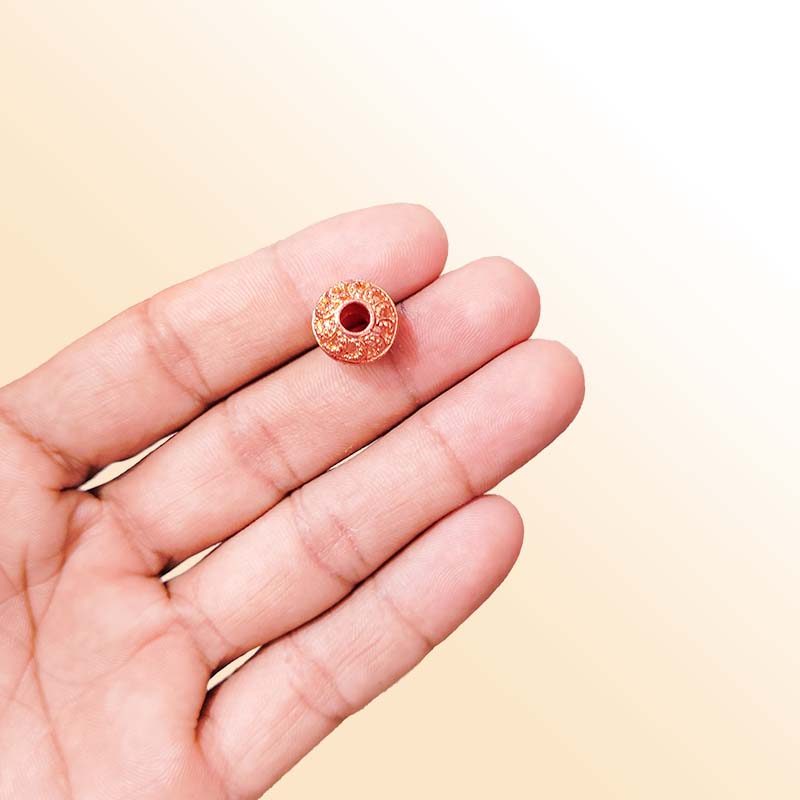 Rose Gold round decorative bead with textured design handcrafted in India for retail jewelry use