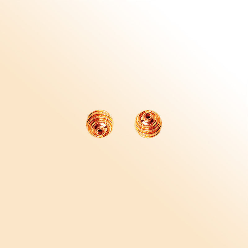 Rose gold ribbed copper bead handcrafted in India with polished finish and rounded shape