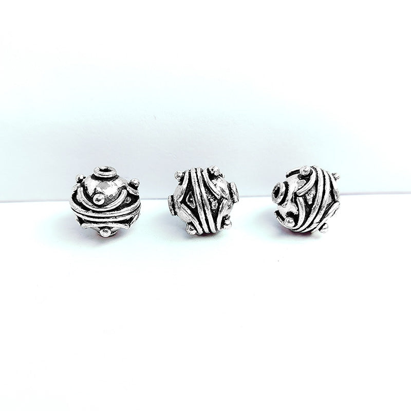 Handcrafted silver overlay round bead from India featuring antique raised dot detailing for jewelry making.