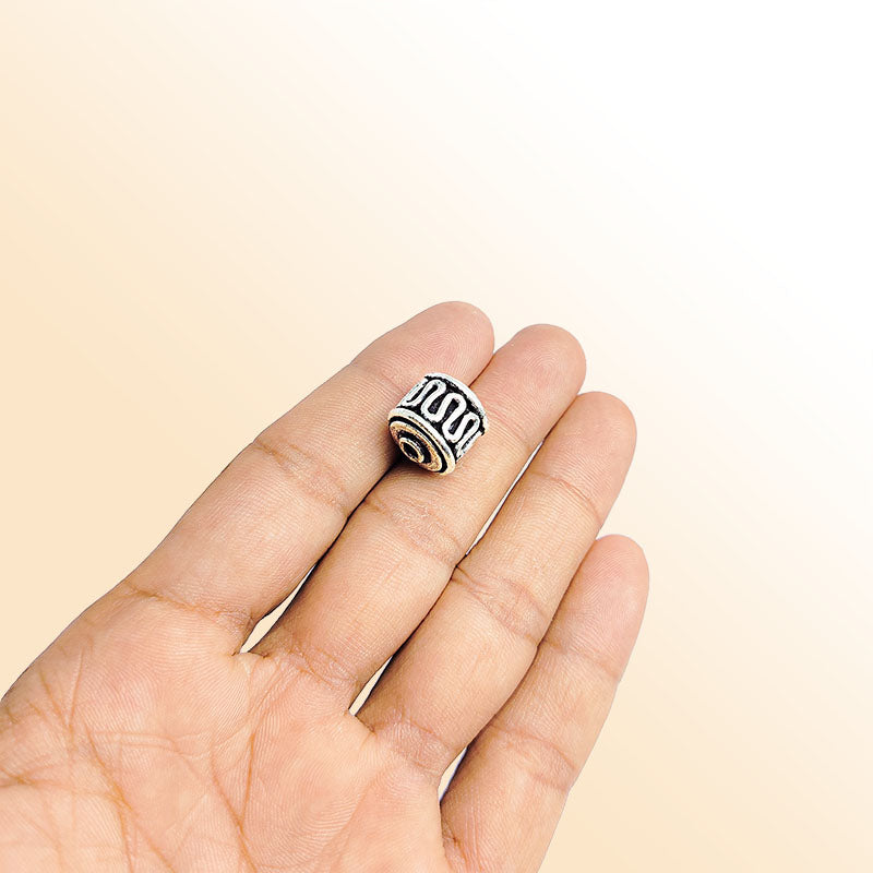 Handcrafted silver overlay barrel bead from India with oxidized finish and wave pattern design for retail jewelry making
