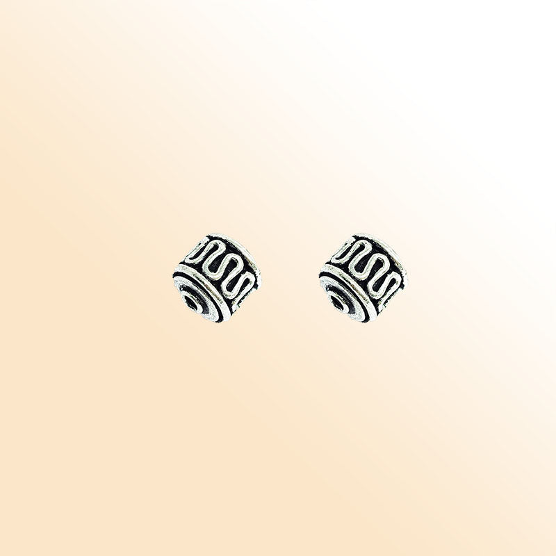 Handcrafted silver overlay barrel bead from India with oxidized finish and wave pattern design for retail jewelry making