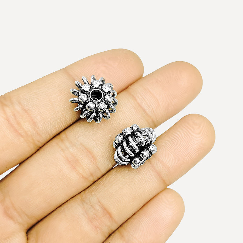 Handcrafted silver overlay floral bead from India with oxidized finish and coiled wire design for retail jewelry making