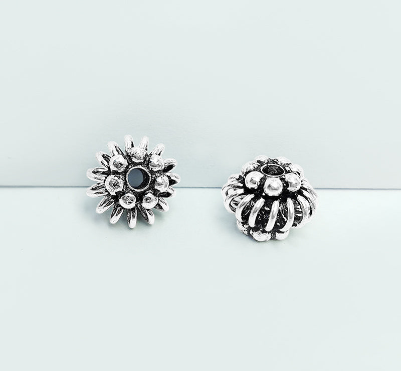Handcrafted silver overlay floral bead from India with oxidized finish and coiled wire design for retail jewelry making
