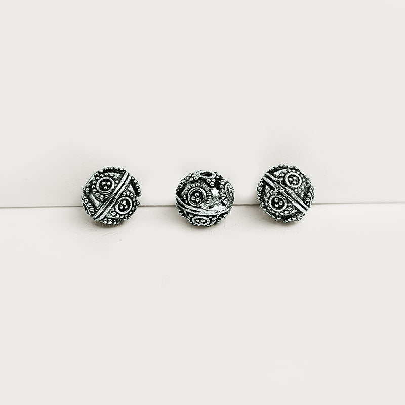 Handcrafted silver overlay round bead from India with oxidized finish and spiral dot design for retail jewelry making