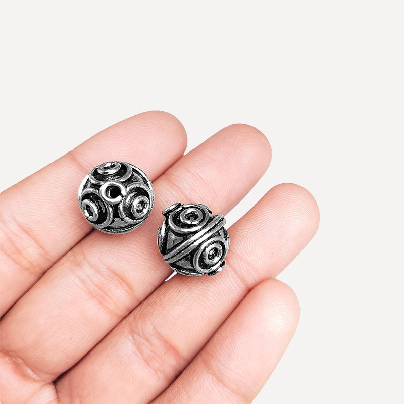 Silver overlay over copper handcrafted circular motif bead from India with antique finish jewelry spacer